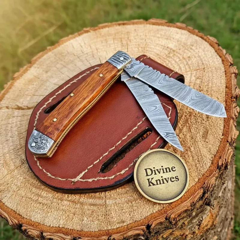 Two-Blade Damascus Trapper Knife with Rosewood HandleHandcrafted Everyday Carry with Damascus Bolsters (34 Inch Blades)